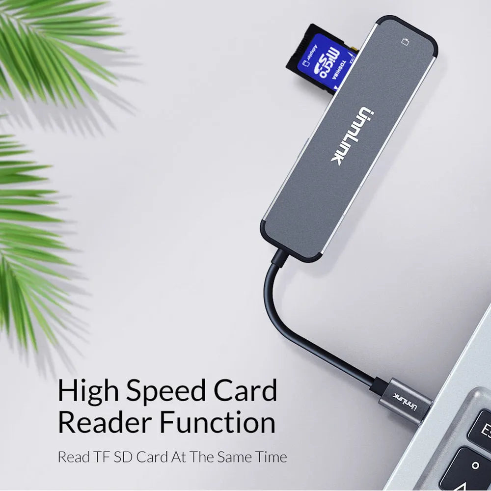 Silver aluminium alloy USB to HDMI adapter with Type-C input and HDMI, SD, TF, USB 3.0 ports
