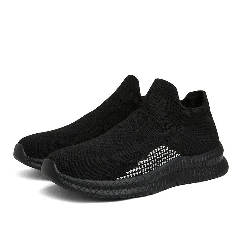 Men's white low-top fabric casual sneakers with round toe and flat sole on a neutral background.