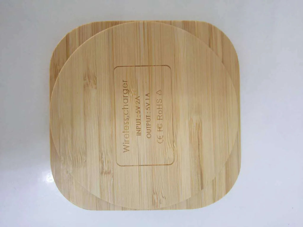 Square wooden bamboo 5W wireless charging pad for smartphones on a desk
