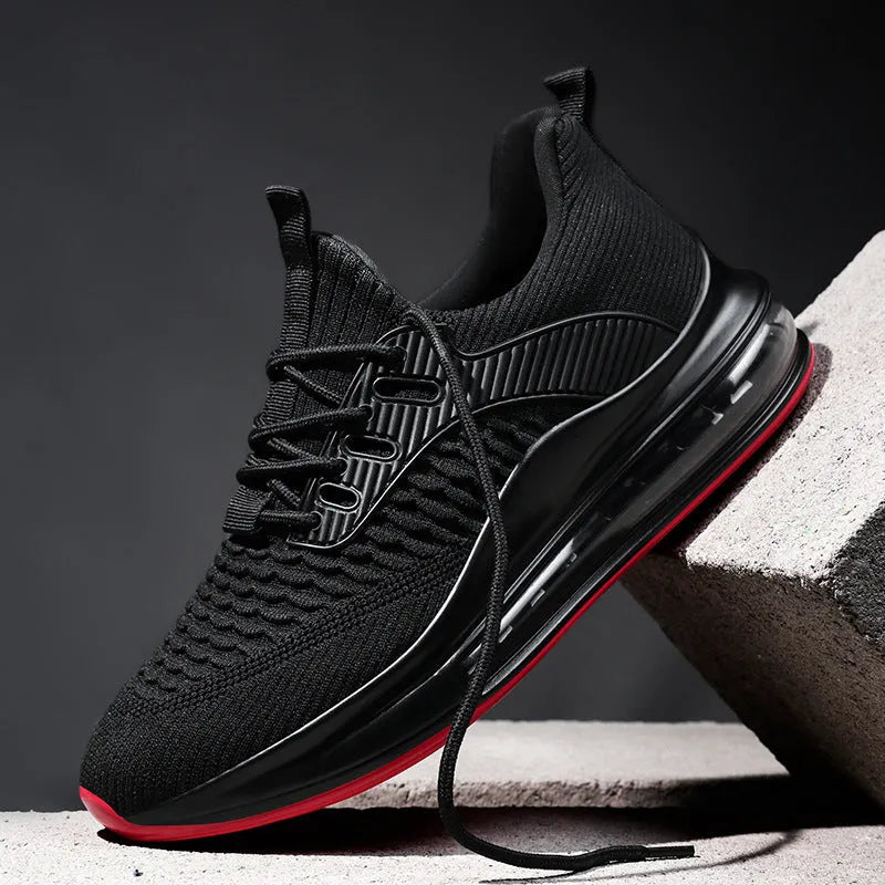 Men's black mesh running shoes with low top, round toe, and lace-up design on rubber sole