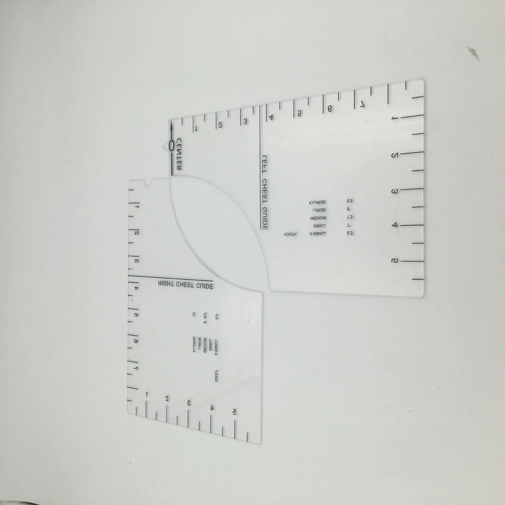 Transparent acrylic sewing ruler for aligning T-shirt designs, measuring 10 by 6 inches.