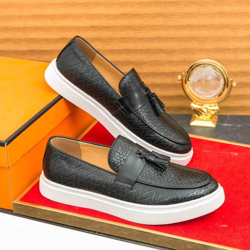 Men's black casual fringed leather shoes with a low heel and round toe on a white background.