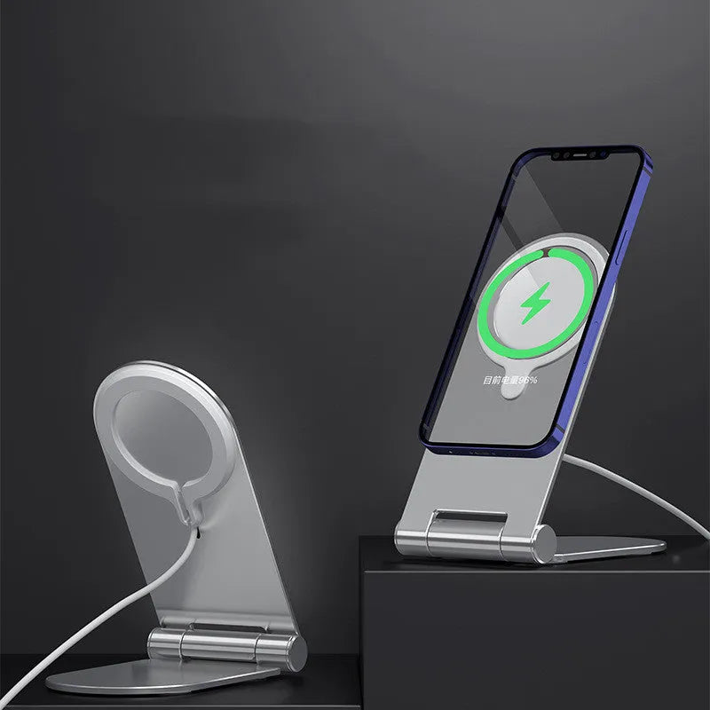 Silver vertical adjustable magnetic phone bracket for iPhone 12 series on a flat surface.