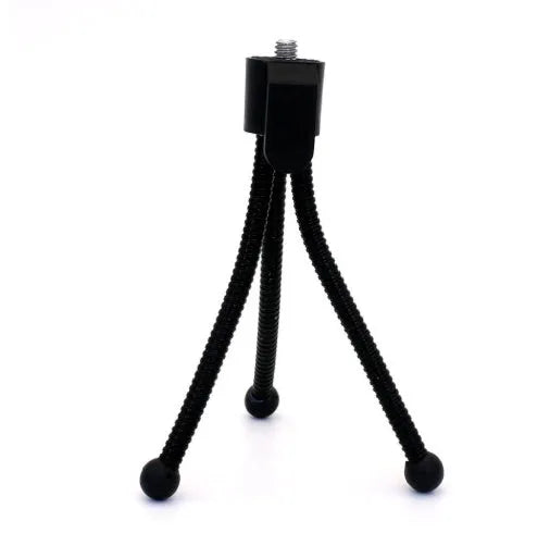 Small black iron mini tripod with ball head, shown extended and collapsed next to a mobile phone.