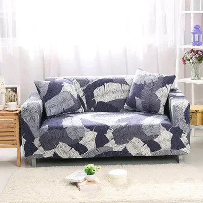 Geometric patterned stretch sofa slipcover on a modern three-seater sofa.