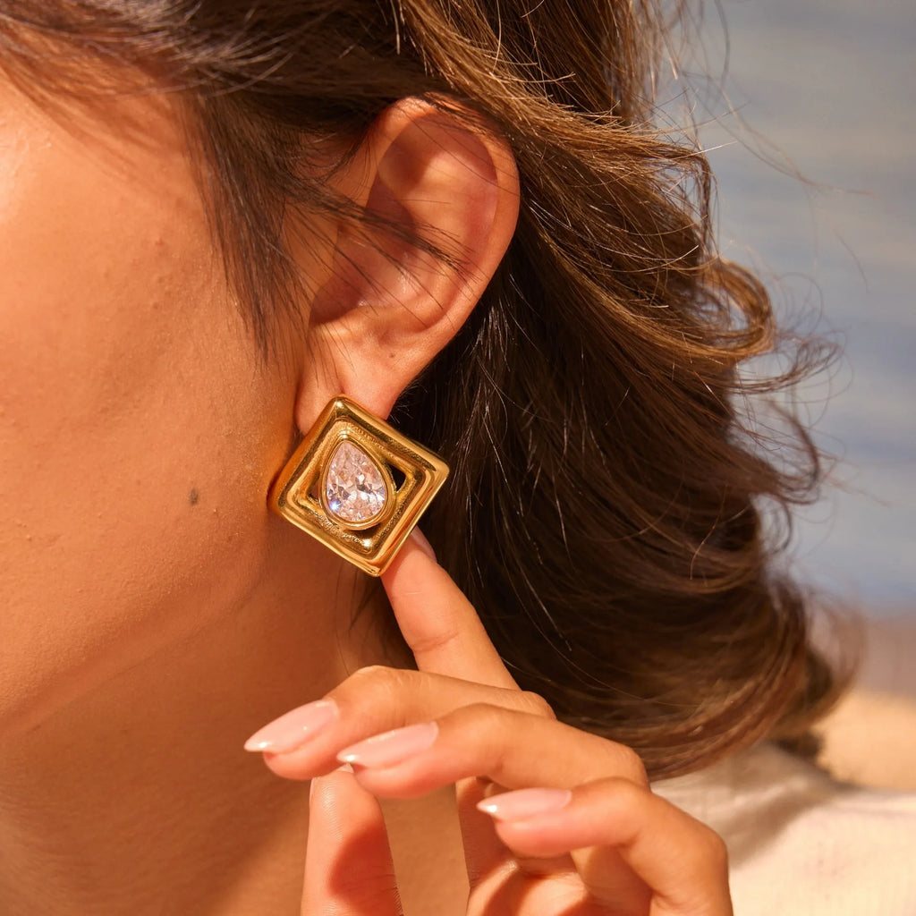 Gold geometric stud earrings with water drop zircon detail on stainless steel