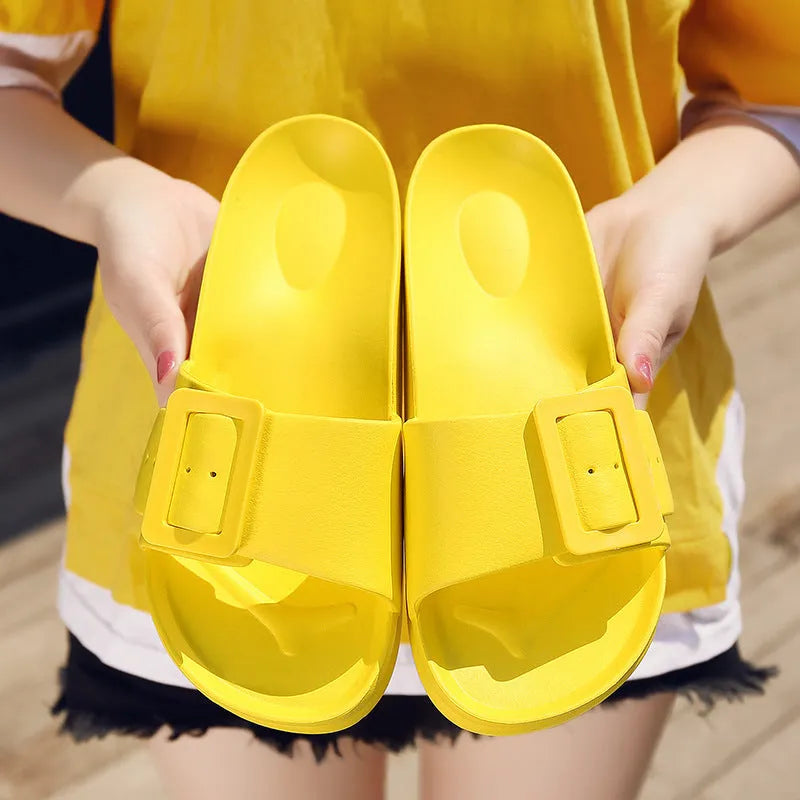 Women's grey blue buckle flip-flop sandals with a soft EVA sole on a plain background