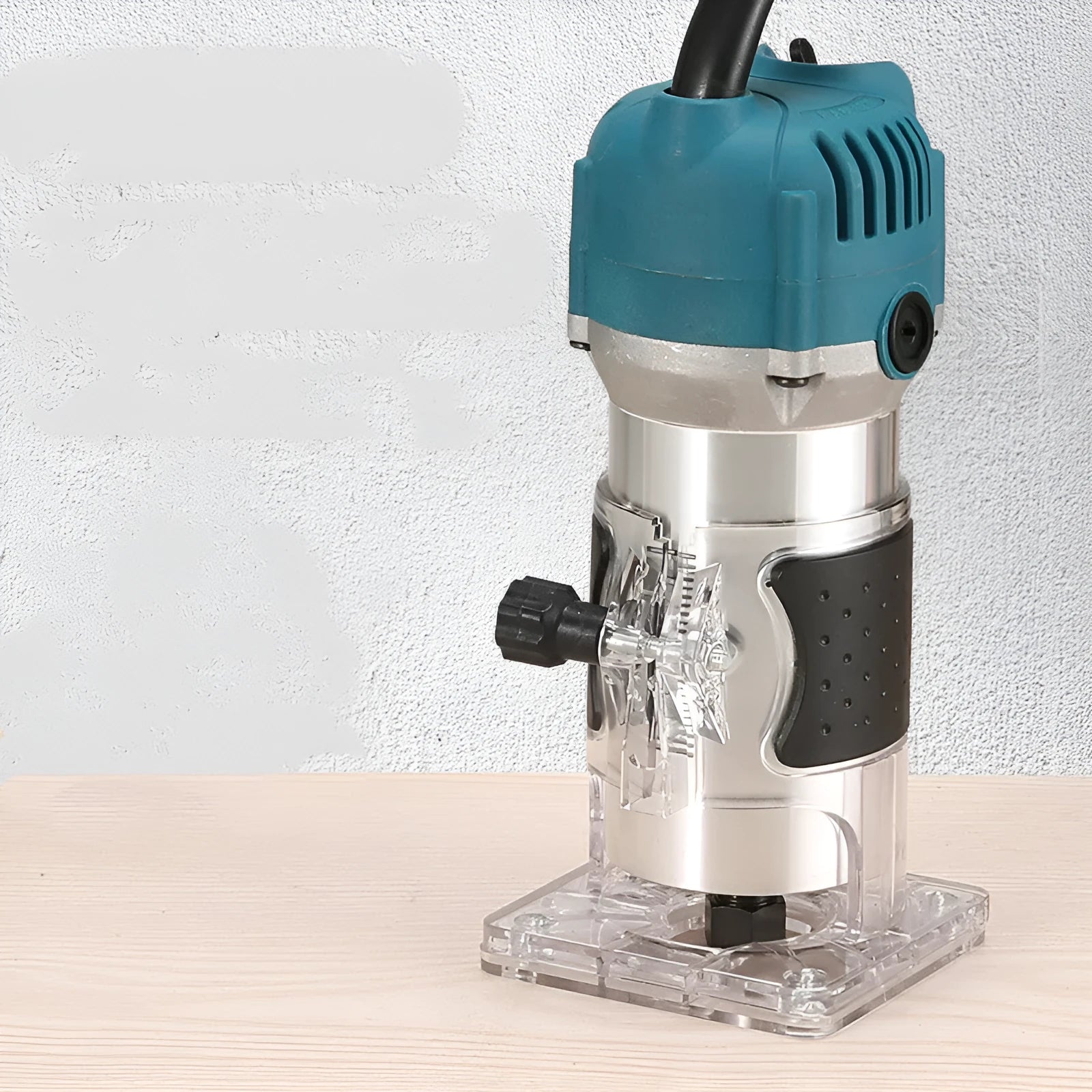 800W electric wood polishing trimmer with aluminium body on a workshop bench.