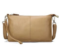Lady cowhide slant bag showing hand strap and shoulder strap options with organised internal compartments