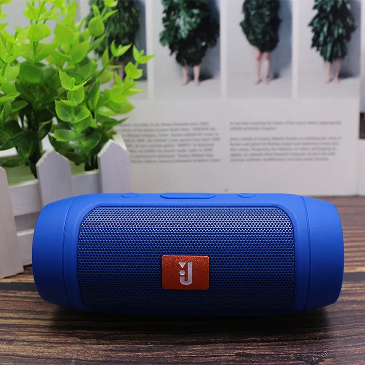 Waterproof Bluetooth speaker with USB interface, 400mAh battery, and 10 metre range in black, blue, grey, or red.