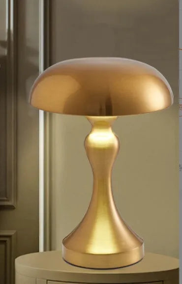 Metallic USB rechargeable LED desk lamp with touch control showing bronze, gold, and silver colour options.