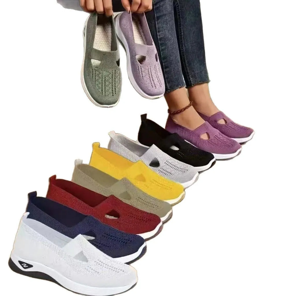 Women's light grey mesh casual flats with a T-strap and round toe on a soft PVC sole.
