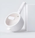 White electric cooking pot with 20cm mouth, 7cm depth, 700W mechanical control, on a dormitory desk