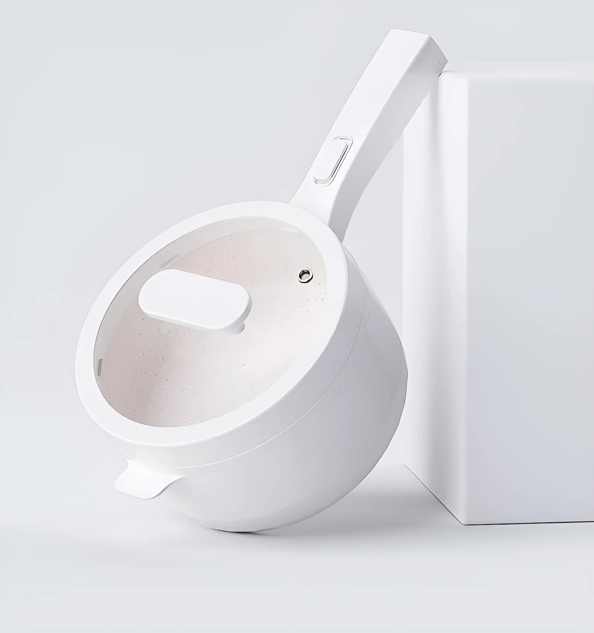 White electric cooking pot with 20cm mouth, 7cm depth, 700W mechanical control, on a dormitory desk