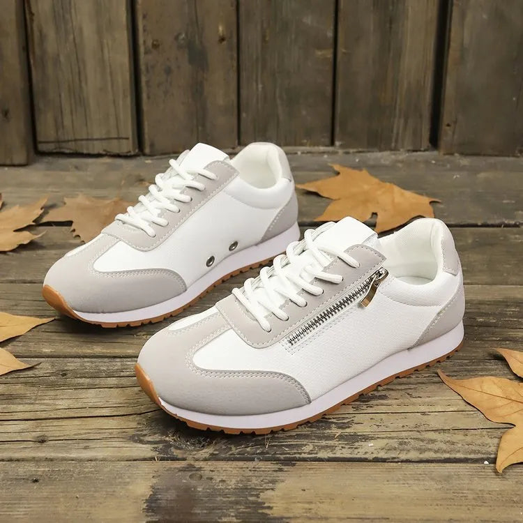 Women's flat-heeled casual shoe in artificial PU, shown in grey, white, and champagne colour options.