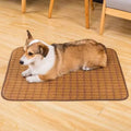 Brown rattan fibre summer cooling mat for dogs on a wooden floor.