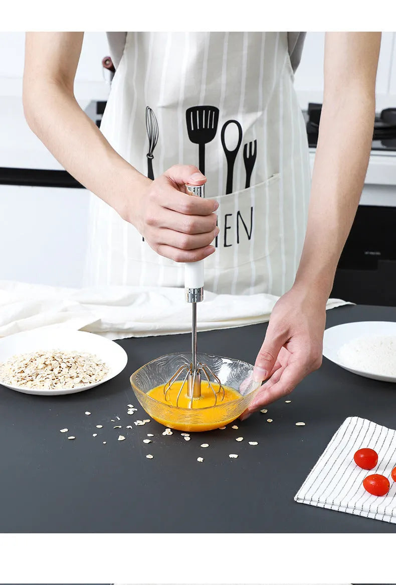 Semi-automatic stainless steel egg beater whisk with hand pressure rotating mechanism in silvery colour