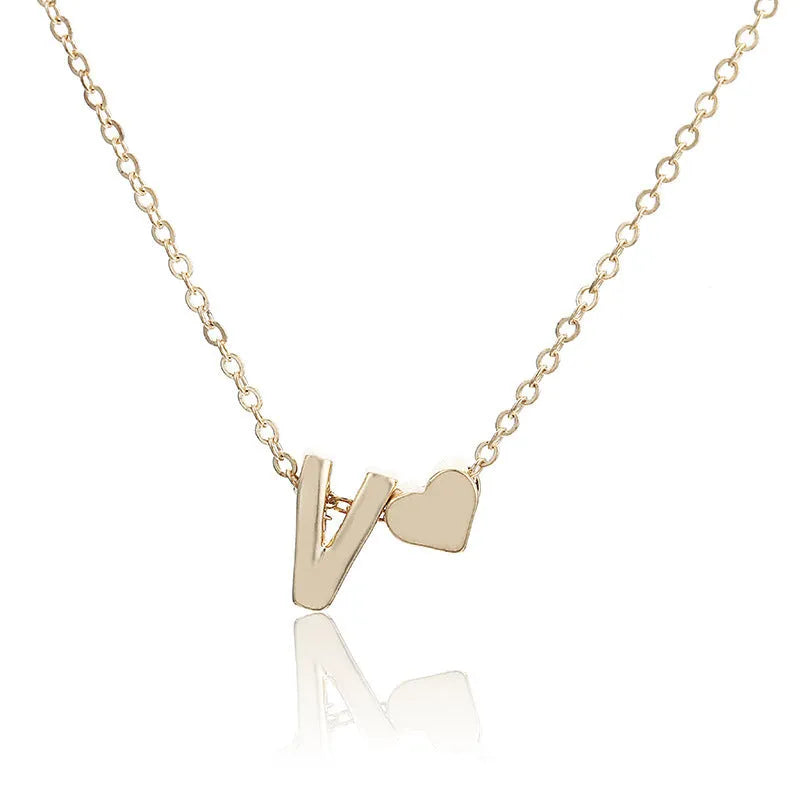 Peach heart shaped letter necklace pendant in gold or silver alloy measuring 20-24mm