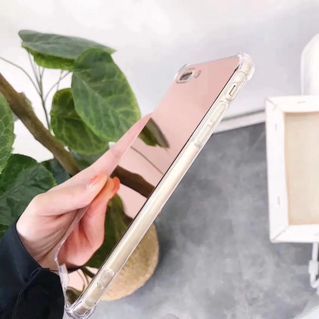 Mirror finish iPhone case with reflective surface showing TPU flexible construction and precise port cutouts
