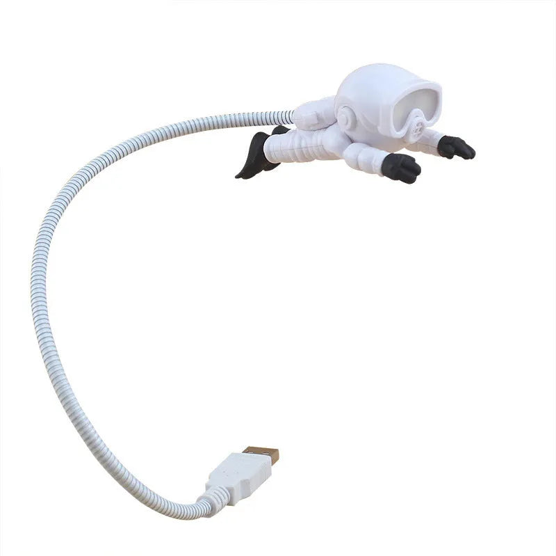 Astronaut USB LED desk lamp with flexible gooseneck and helmet switch on a desk