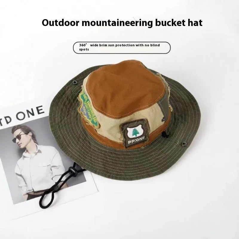 Army green cotton women's fisherman hat with flat top crown and hand-painted patchwork design
