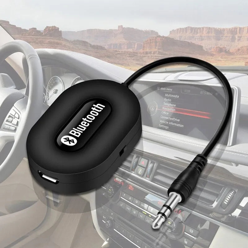 Black B5 Bluetooth music receiver with 3.5mm audio cable and USB charging cable