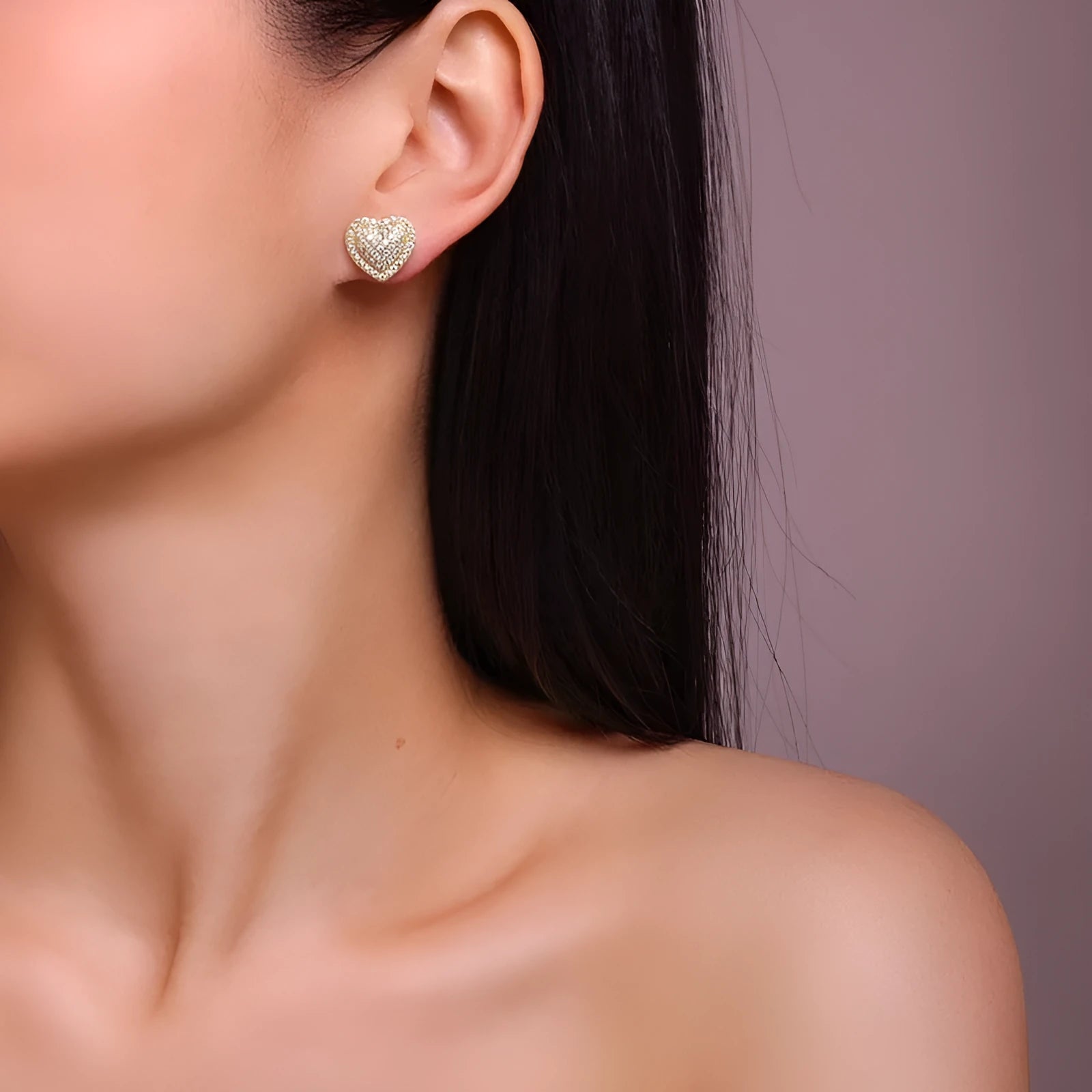 Gold-plated S925 silver stud earrings with a heart-shaped moissanite stone.