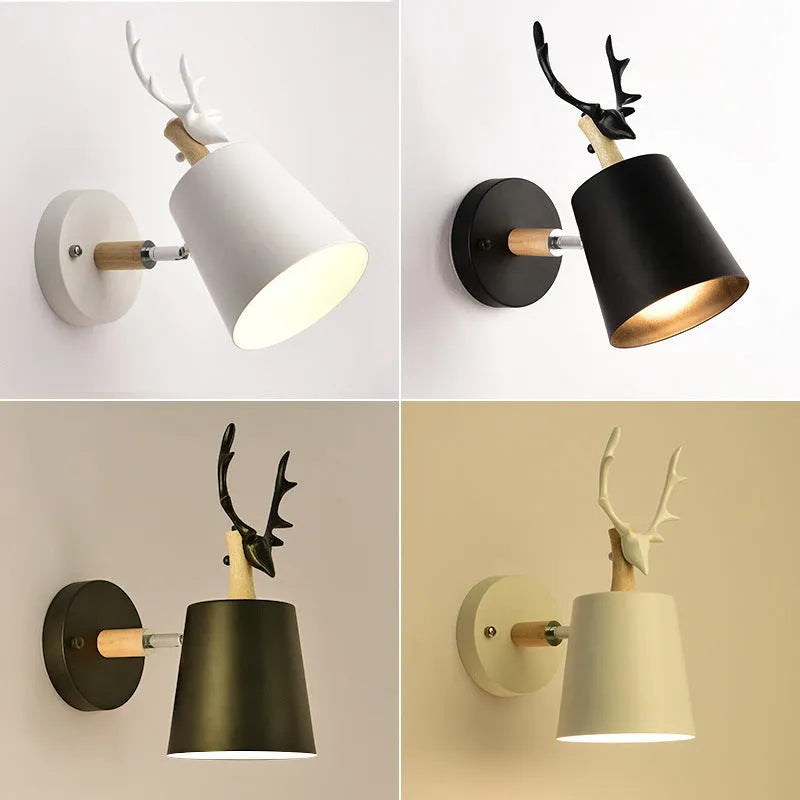 Modern antler wall lamp in black finish with iron and wood construction, measuring 24x29cm