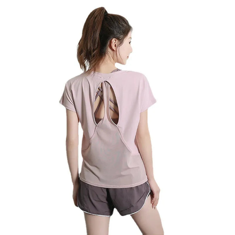 Women's short sleeve polyester sports T-shirt in grey green, shown on a model.
