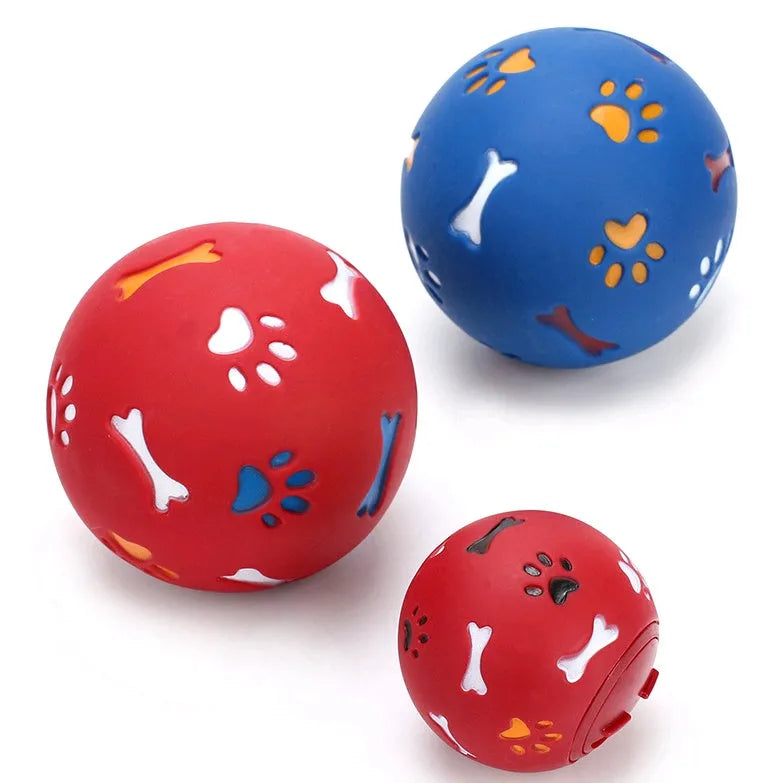 Rubber puzzle ball for dogs with uneven surface, footprints pattern, blue and red colours, sizes 7.5cm and 11cm