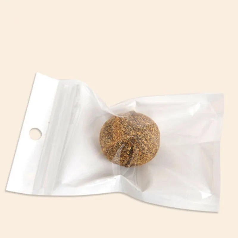 Natural catnip treat ball for cats, with catnip scent inside, on a neutral background