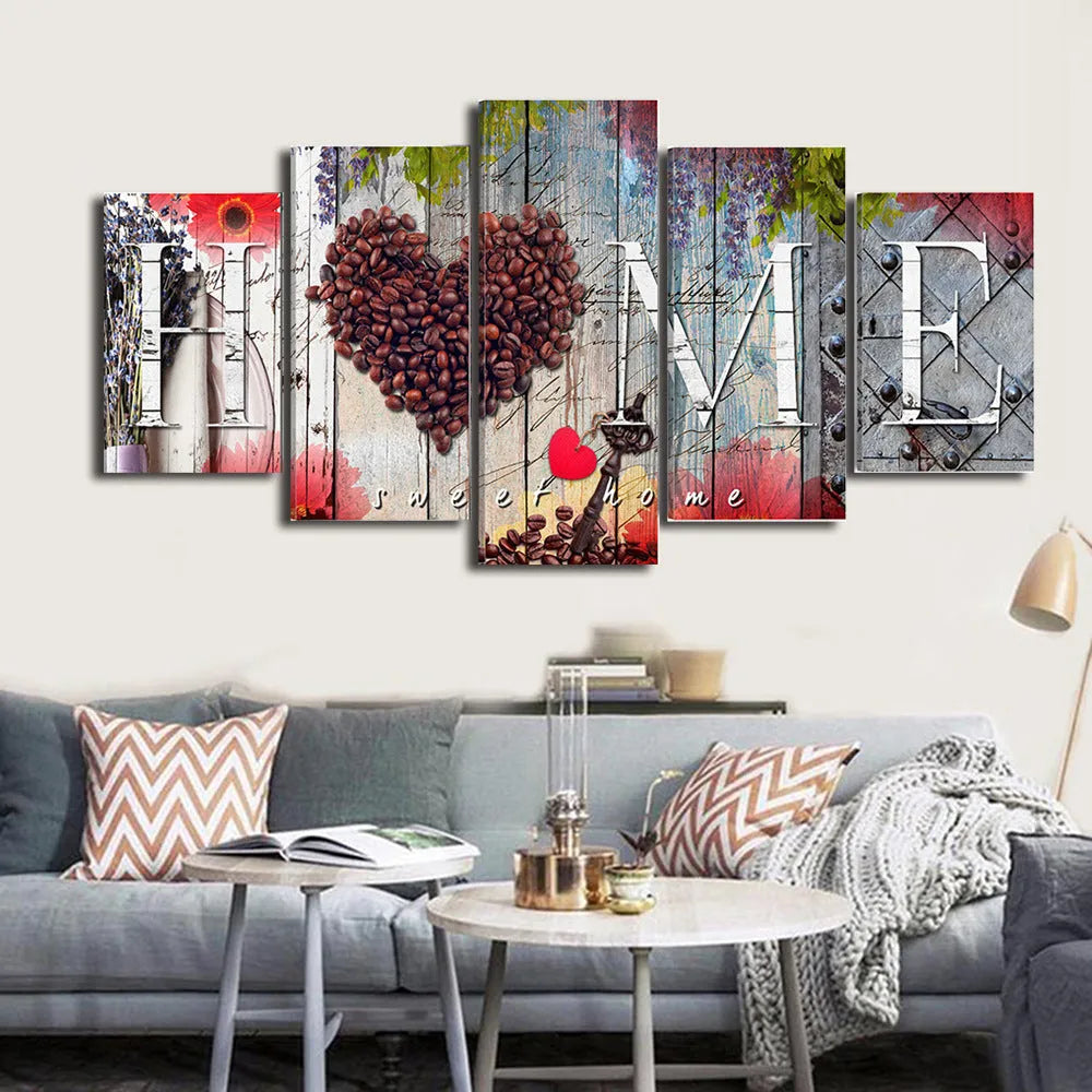 Set of five red unframed canvas wall art prints in graduated sizes arranged on a wall.