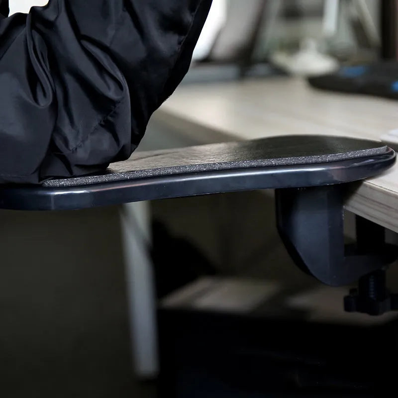 Ergonomic computer hand bracket mouse wrist pad in black leather finish with non-slip rubber base on a desk