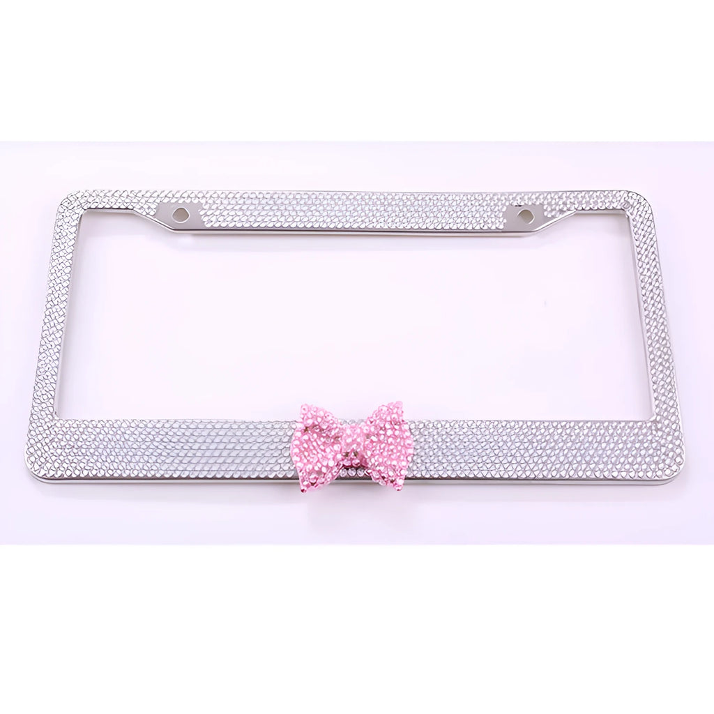 Stainless steel rhinestone license plate frame with hand-set diamonds, 31x6x1.5cm, in black, pink or white.