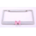 Stainless steel rhinestone license plate frame with hand-set diamonds, 31x6x1.5cm, in black, pink or white.