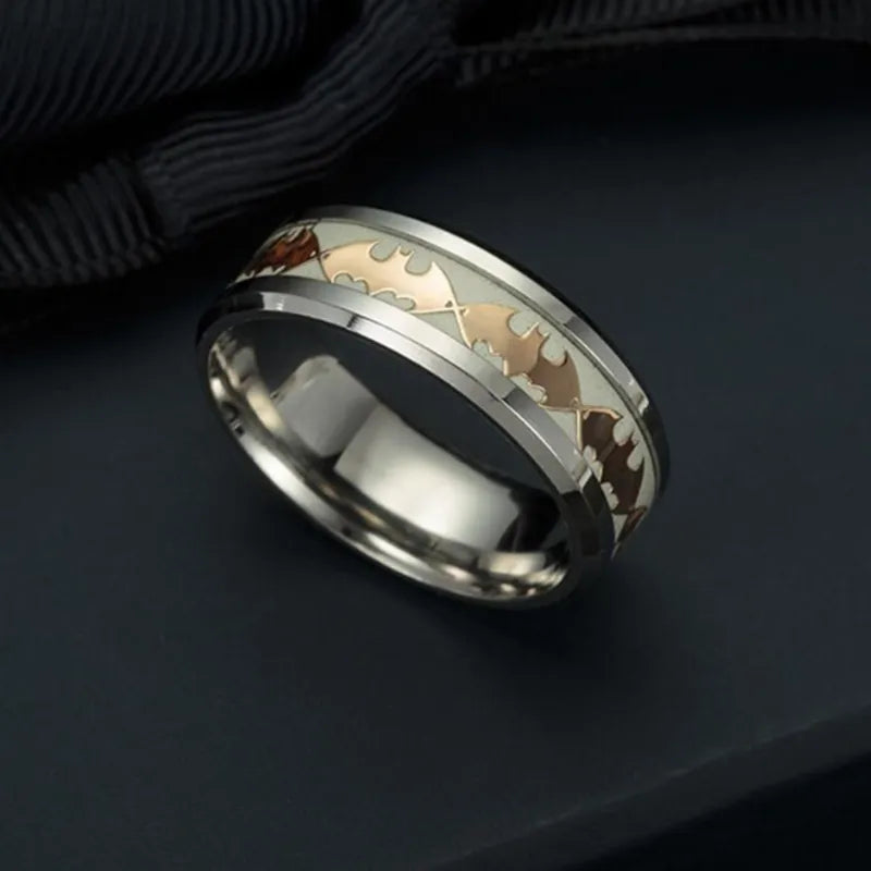 Stainless steel Batman ring with luminous glow in the dark finish in silver colour on a black background