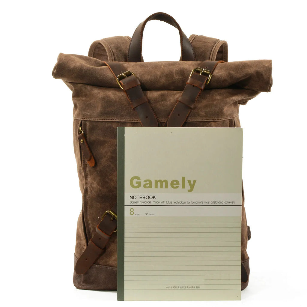 Waterproof canvas rucksack with linen lining, 20-35L capacity, softback design, shown in black, coffee, or celadon colour options.