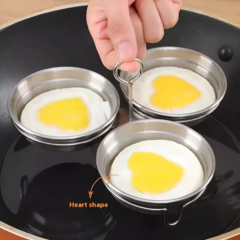 Stainless steel mini egg cooker with a heart-shaped mould and a round mould for steaming eggs.