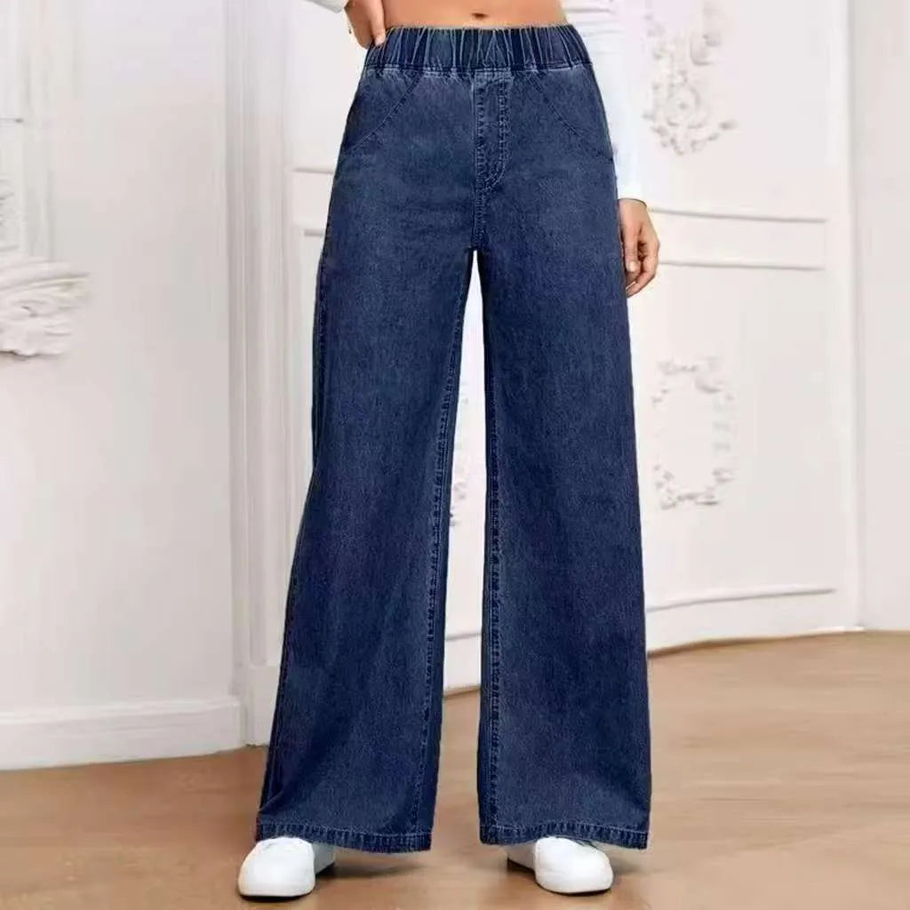 Light blue washed wide-leg women's denim jeans with straight fit and mid-rise waist