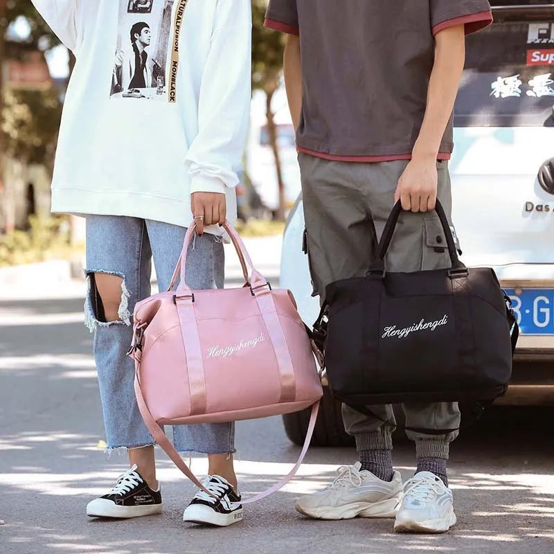 Medium 36-55L Oxford cloth travel duffel bag with zip pockets, soft handle, available in blue, black, grey and pink.