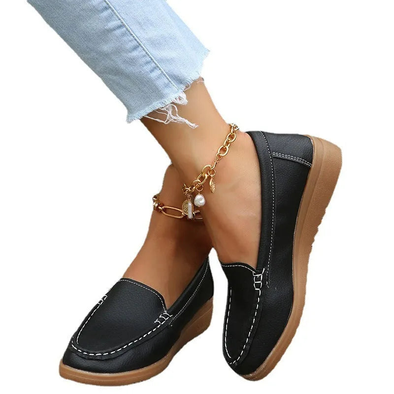Women's black PU leather loafers flats with round toe and slip-on design on a white background.