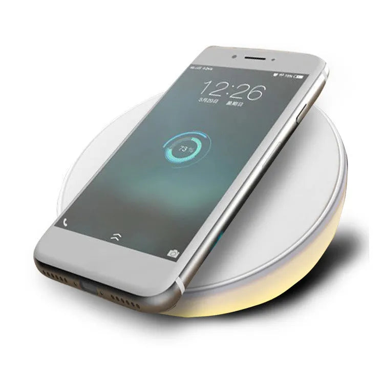 White wireless charging pad with digital clock display and control buttons for QI smartphone charging