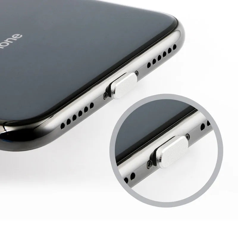 Aluminium alloy iPhone charging port dust plug in various colours including gold, silver, blue, and rose gold.