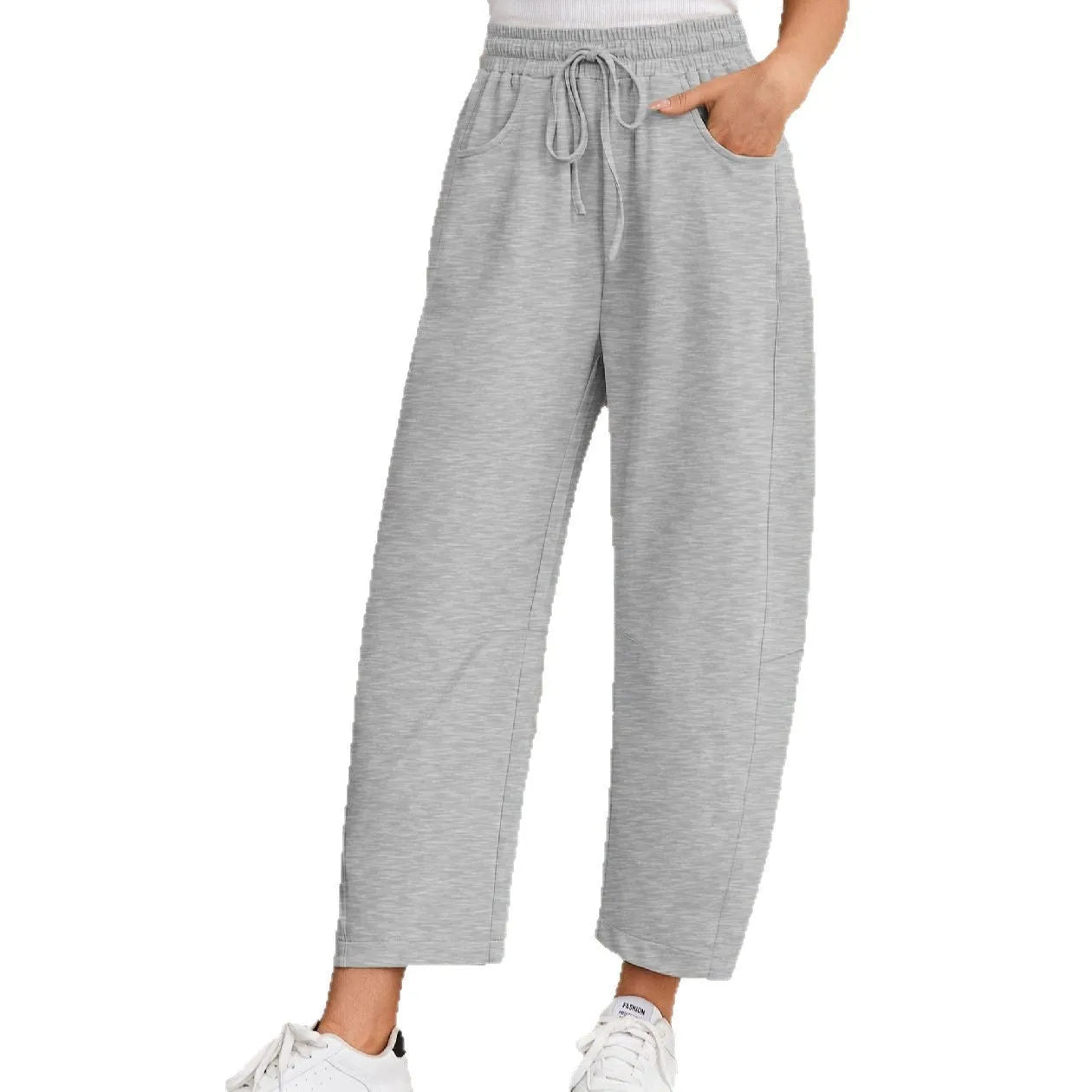 Loose cropped sweatpants with drawstring waist and side pockets in street fashion styling