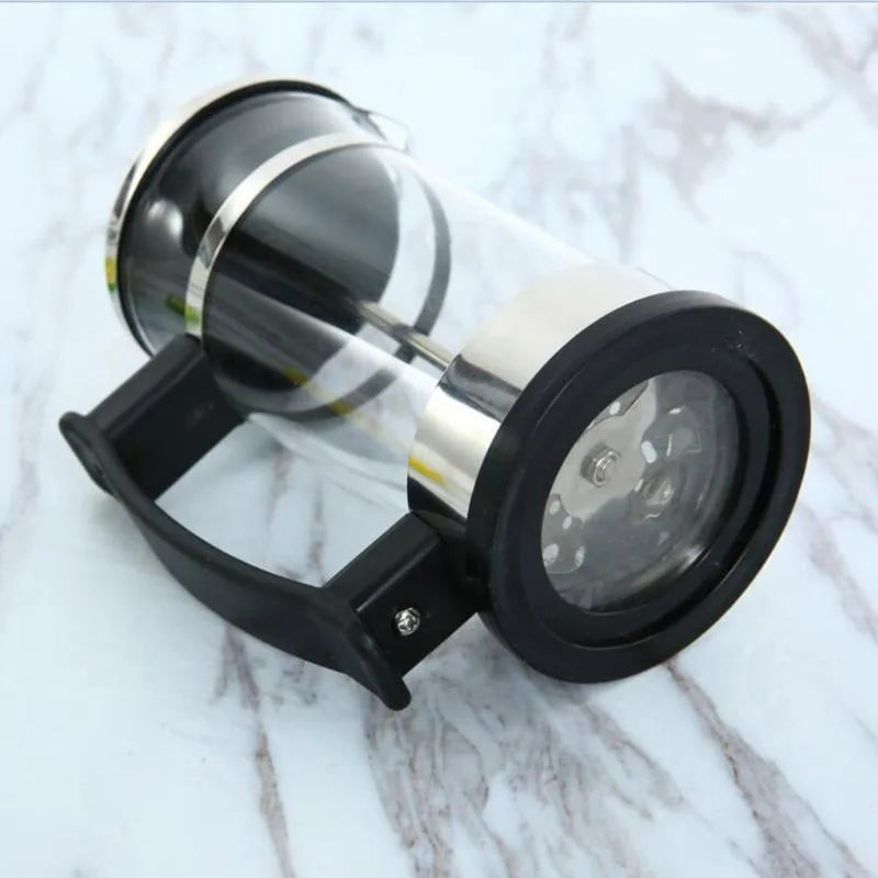 Compact pour-over coffee maker with glass carafe and stainless steel filter holder
