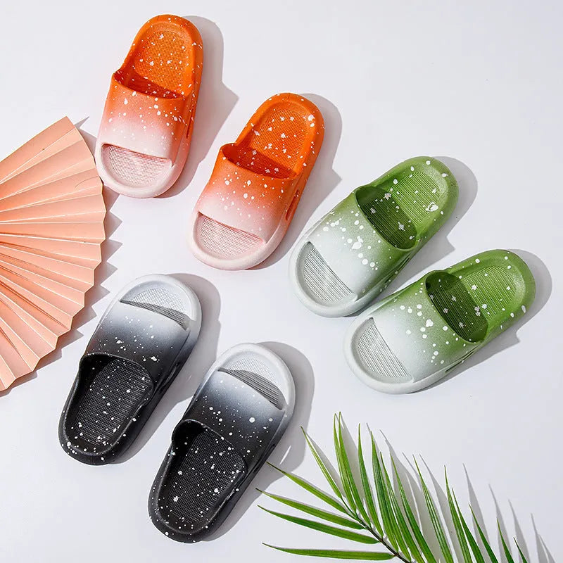 Gradient coloured PVC summer slippers for children on a plain background, showing the non-slip sole.