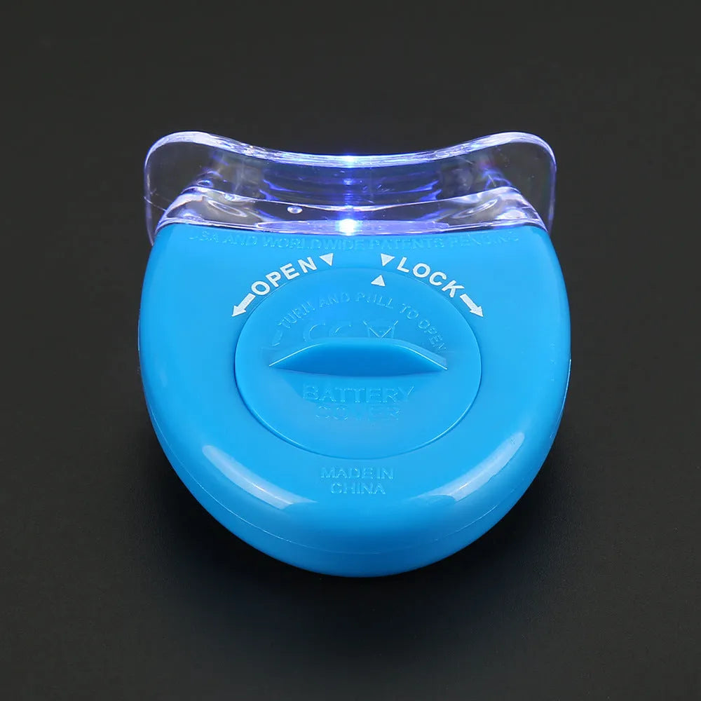 LED teeth whitening kit with button switch and denture tray in blue