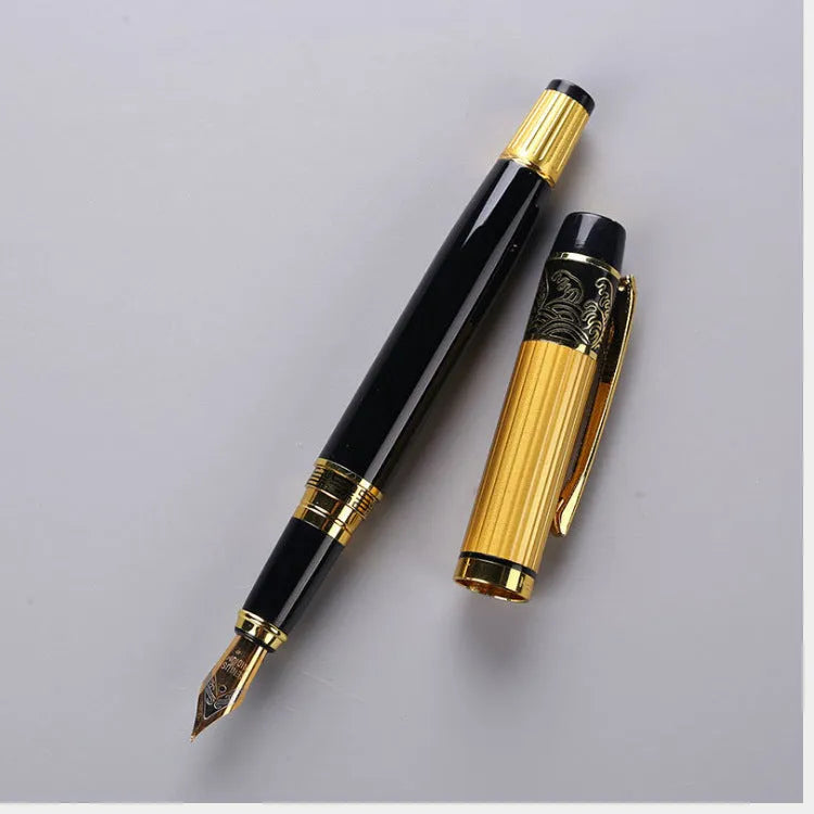 Black metal fountain pen with iridium nib and patterned orb design, shown on a desk