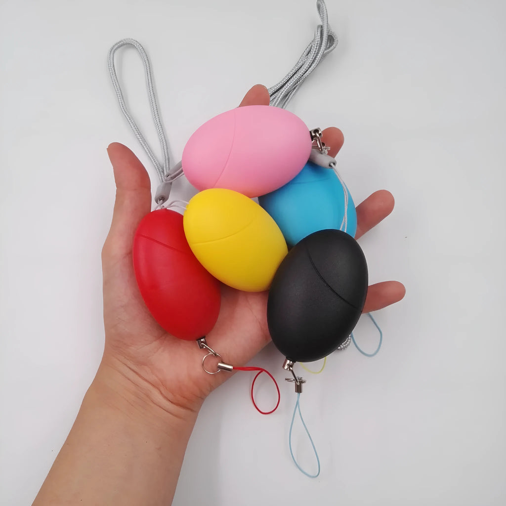 Oval personal alarm in black, blue, pink, red, or yellow with 120dB siren for women, elderly and children
