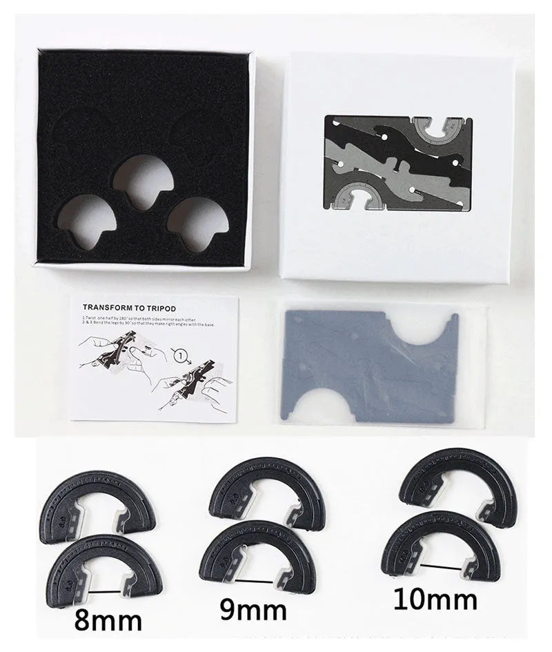 Black plastic card type mobile phone holder on desktop surface